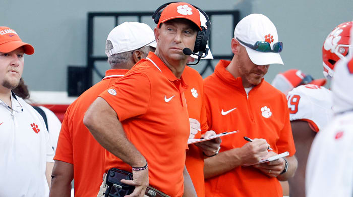 Clemson head coach Dabo Swinney watches a replay from the sideline during the second half against NC State.